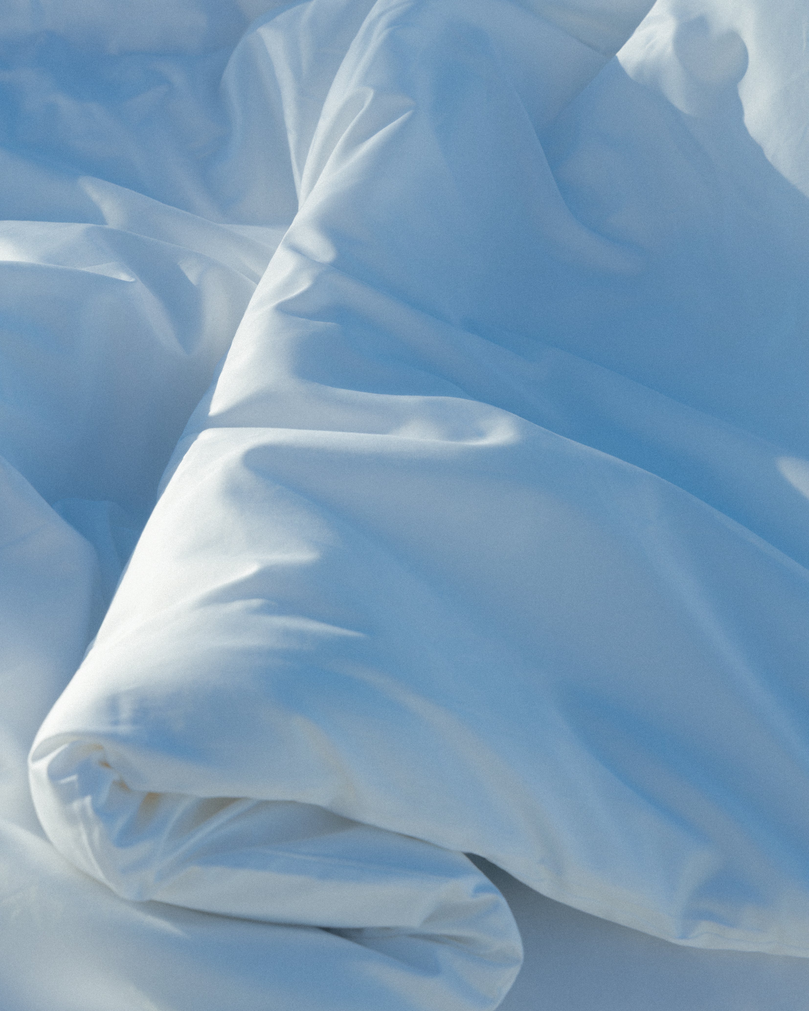closeup of an Abate white duvet with folds